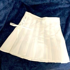 A mini white skirt from Forever 21. Brand new without tags. Size medium.